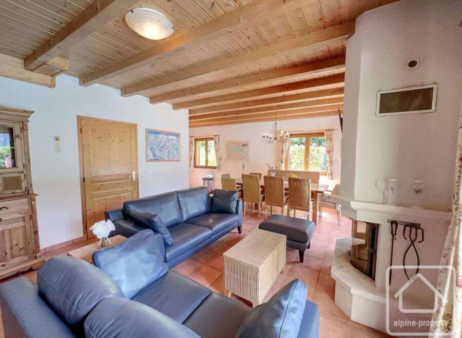 Discover the charm of this stunning property, featuring a cozy living area with a fireplace and comfortable seating.