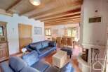 Discover the charm of this stunning property, featuring a cozy living area with a fireplace and comfortable seating.