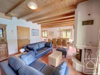 Discover the charm of this stunning property, featuring a cozy living area with a fireplace and comfortable seating.
