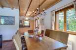 This charming dining area features a rustic wooden table, perfect for family gatherings.