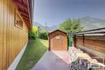 Discover the charm of this property, featuring a cozy wooden shed and a beautifully stacked woodpile.