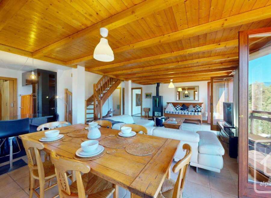 Experience the charm of this stunning property, featuring a warm and inviting wooden ceiling that adds a touch of rustic elegance.