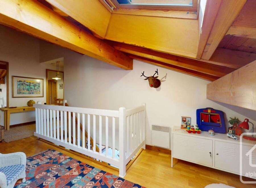 Discover the charm of this unique property, featuring a cozy interior with exposed wooden beams and a stylish design.
