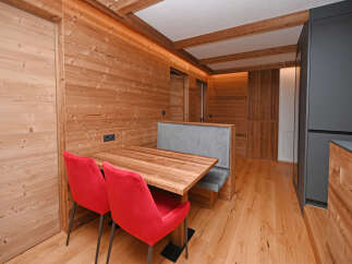Experience the warmth of this beautifully designed space, featuring stunning wood paneling and flooring throughout.