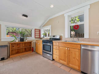This charming kitchen boasts a bright and airy atmosphere, perfect for culinary adventures.