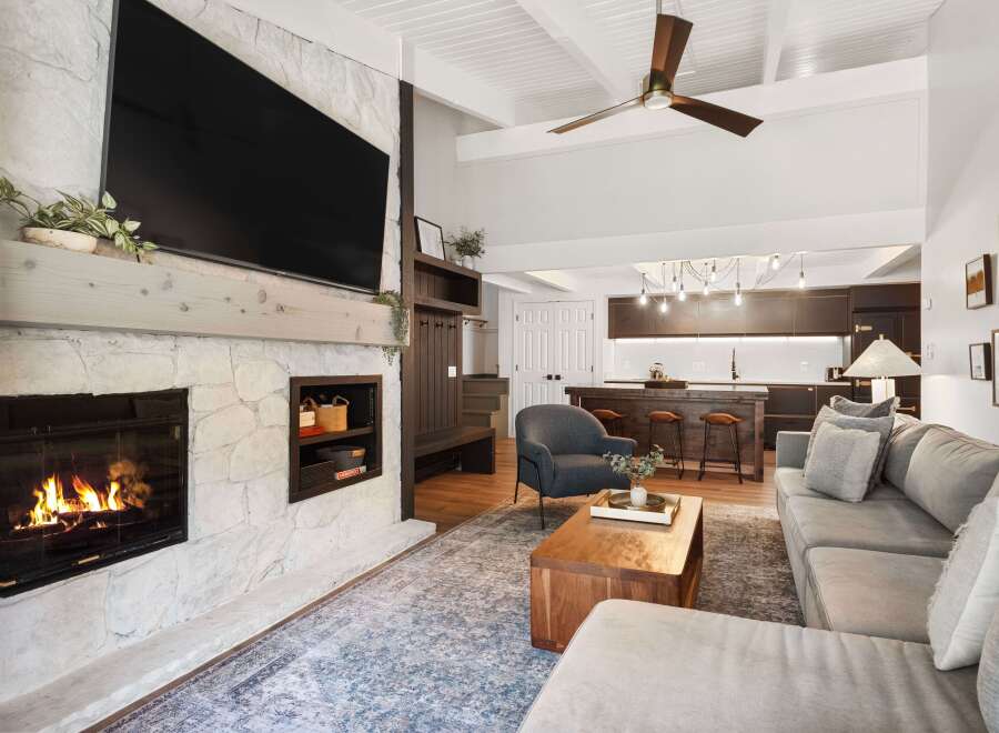 This stunning living room boasts a cozy fireplace, perfect for chilly evenings.