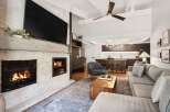 This stunning living room boasts a cozy fireplace, perfect for chilly evenings.