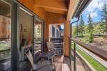 Enjoy breathtaking views from this stunning balcony! This outdoor space features a cozy seating area, perfect for relaxing and taking in the surrounding natural beauty.