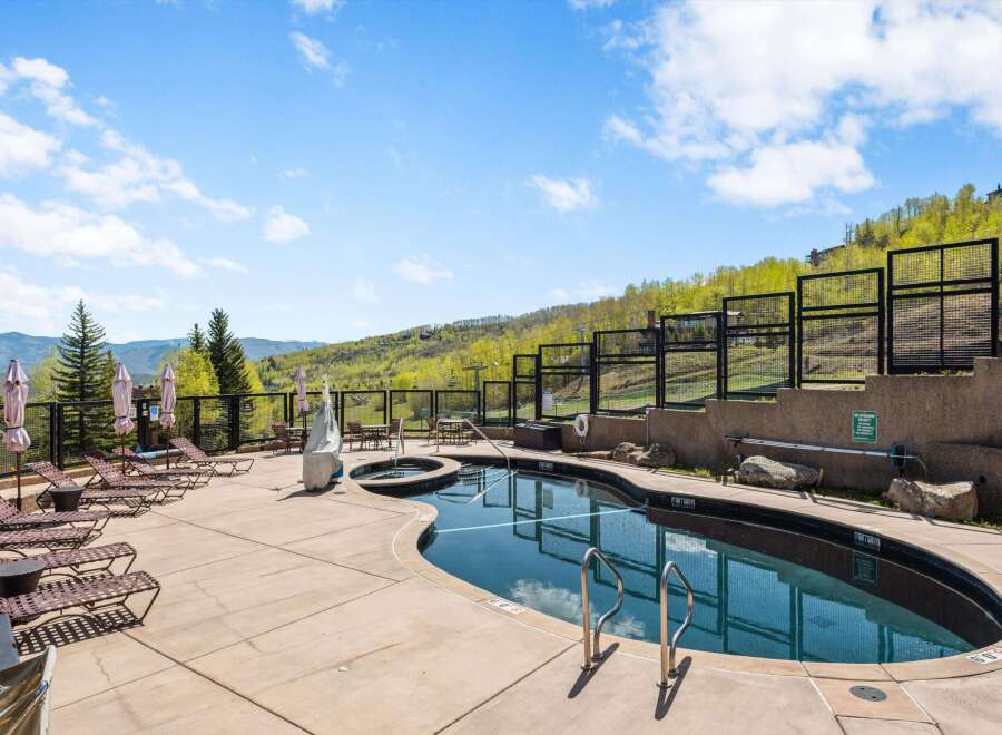 Enjoy the ultimate relaxation at this stunning property featuring a luxurious outdoor pool and hot tub.