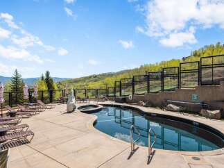 Enjoy the ultimate relaxation at this stunning property featuring a luxurious outdoor pool and hot tub.