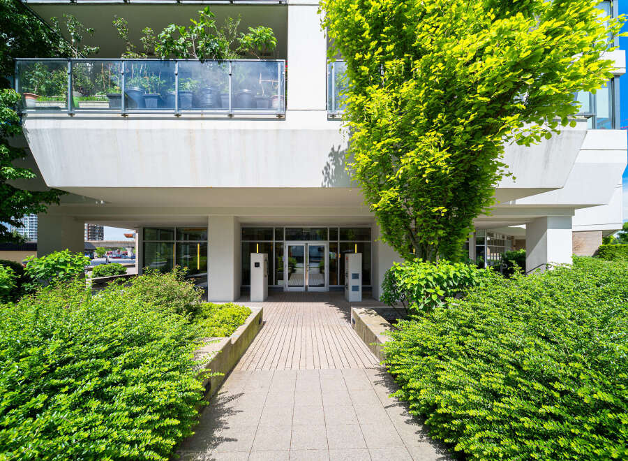 Discover modern living at this stunning property, featuring a beautifully landscaped entrance and a welcoming facade.