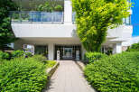 Discover modern living at this stunning property, featuring a beautifully landscaped entrance and a welcoming facade.