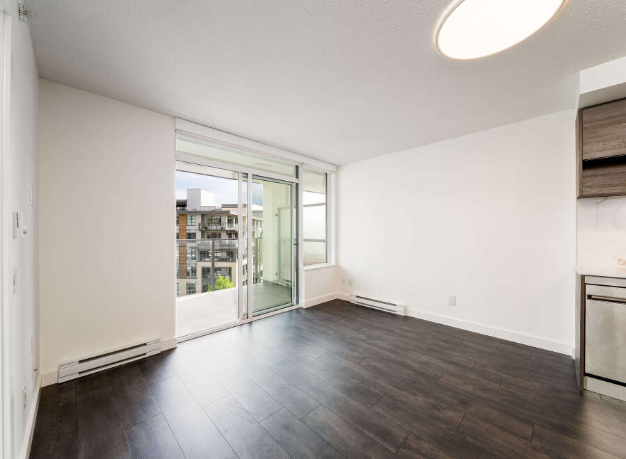 Discover modern living in this stunning property! Featuring a spacious interior with sleek dark wood flooring, this home offers a contemporary aesthetic.