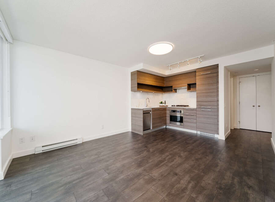 Discover modern living in this stylish condo featuring a sleek kitchen with stainless steel appliances and ample cabinet space.