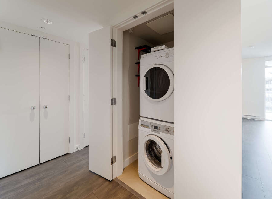 Discover modern living in this stunning property, featuring a convenient in-unit laundry setup.