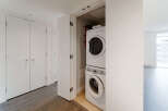 Discover modern living in this stunning property, featuring a convenient in-unit laundry setup.