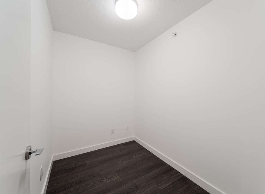 Step into this bright and airy space, perfect for a home office or a cozy reading nook.