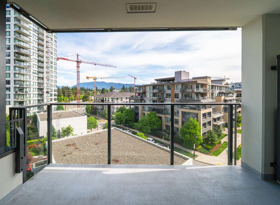 Enjoy stunning views from this modern condo's balcony.