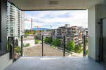 Enjoy stunning views from this modern condo's balcony.