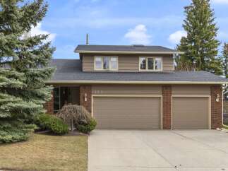 This charming home features a spacious two-car garage and a well-maintained exterior.