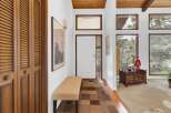 Step into this inviting entryway, showcasing a blend of classic and contemporary design.