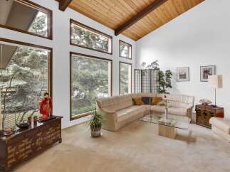 Step into this stunning living room, showcasing a blend of natural light and elegant design.