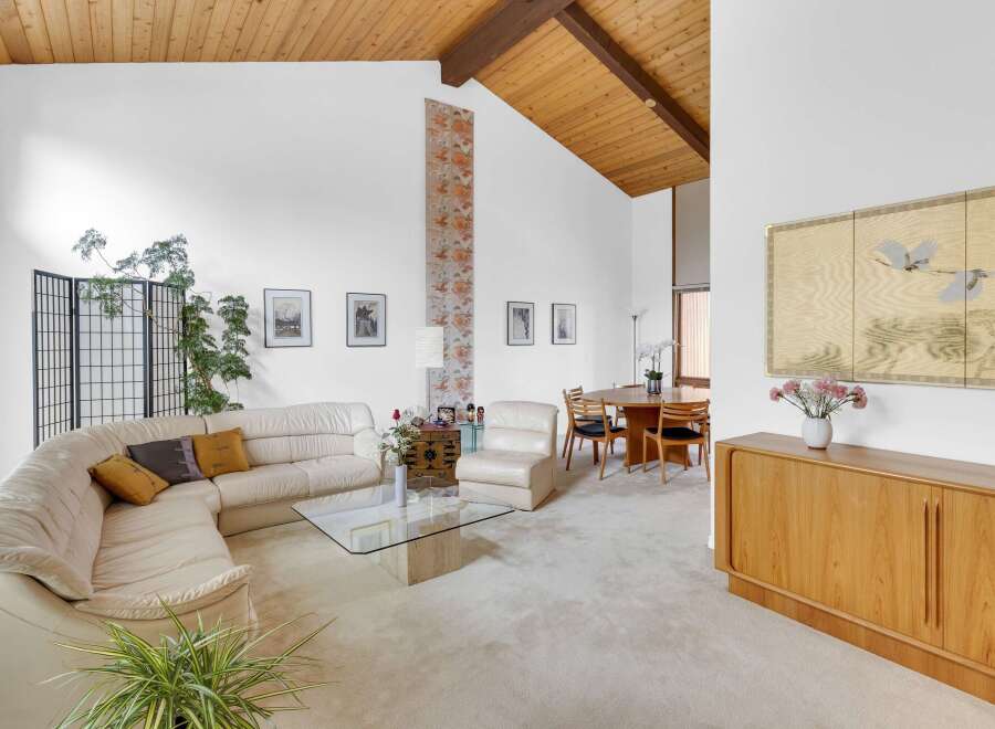 Step into this stunning mid-century modern home, showcasing a bright and airy living space.