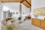 Step into this stunning mid-century modern home, showcasing a bright and airy living space.