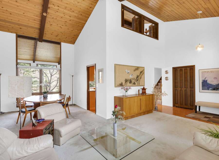 This stunning property boasts a spacious living area with soaring ceilings and an abundance of natural light.
