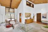 This stunning property boasts a spacious living area with soaring ceilings and an abundance of natural light.