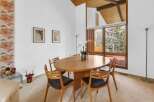 This stunning dining room features a beautiful oval wooden table and stylish chairs, perfect for hosting gatherings.