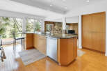 This stunning kitchen boasts a modern design with sleek cabinetry and granite countertops.