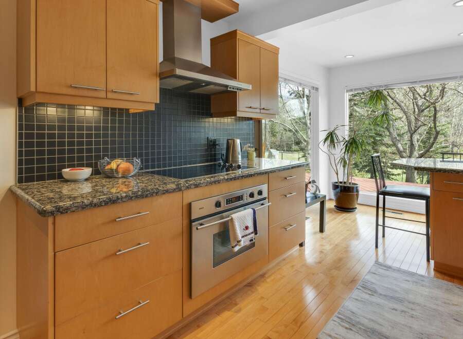 This stunning kitchen boasts modern cabinetry and sleek stainless steel appliances.