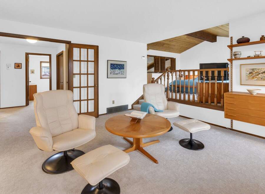 This stunning property features a bright and airy living room with a cozy seating area.