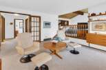 This stunning property features a bright and airy living room with a cozy seating area.