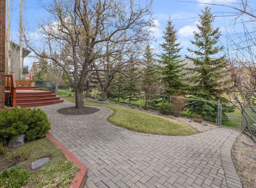 Discover the charm of this property, featuring a beautifully paved walkway that leads to a welcoming outdoor space.