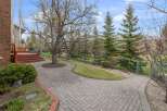 Discover the charm of this property, featuring a beautifully paved walkway that leads to a welcoming outdoor space.