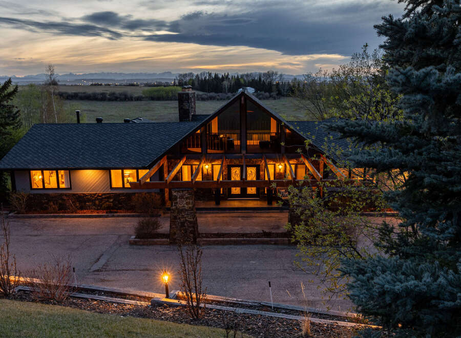 This stunning property boasts a unique architectural design with a blend of natural materials and modern elements.