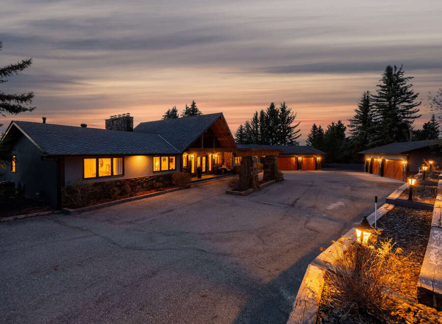 This stunning property boasts a luxurious estate with a grand entrance and ample parking space.