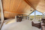This stunning property boasts a spacious loft area with a vaulted wooden ceiling, creating an open and airy feel.