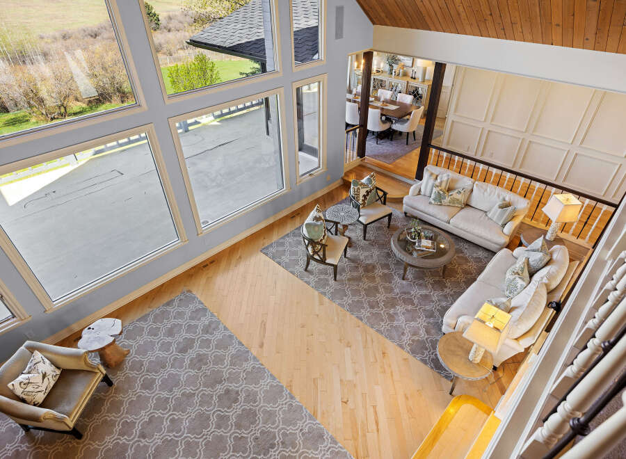 This stunning property boasts a grand, open-concept living space with soaring ceilings and abundant natural light.