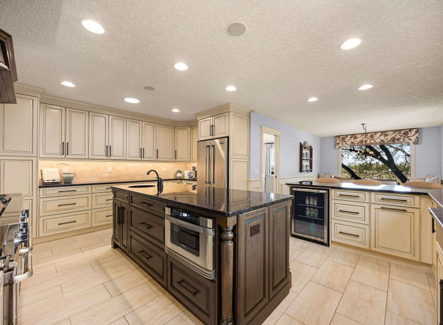This stunning kitchen boasts a spacious layout with ample storage and modern appliances.