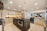 This stunning kitchen boasts a spacious layout with ample storage and modern appliances.