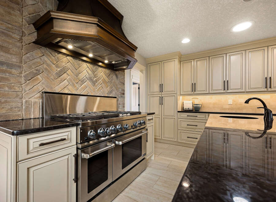 This stunning kitchen boasts a luxurious design with high-end appliances and exquisite finishes.