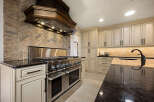 This stunning kitchen boasts a luxurious design with high-end appliances and exquisite finishes.