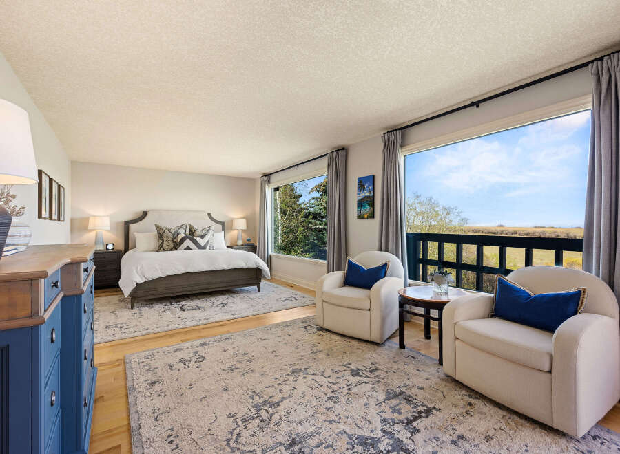 This stunning bedroom offers a serene retreat with its elegant design and breathtaking views.