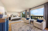 This stunning bedroom offers a serene retreat with its elegant design and breathtaking views.