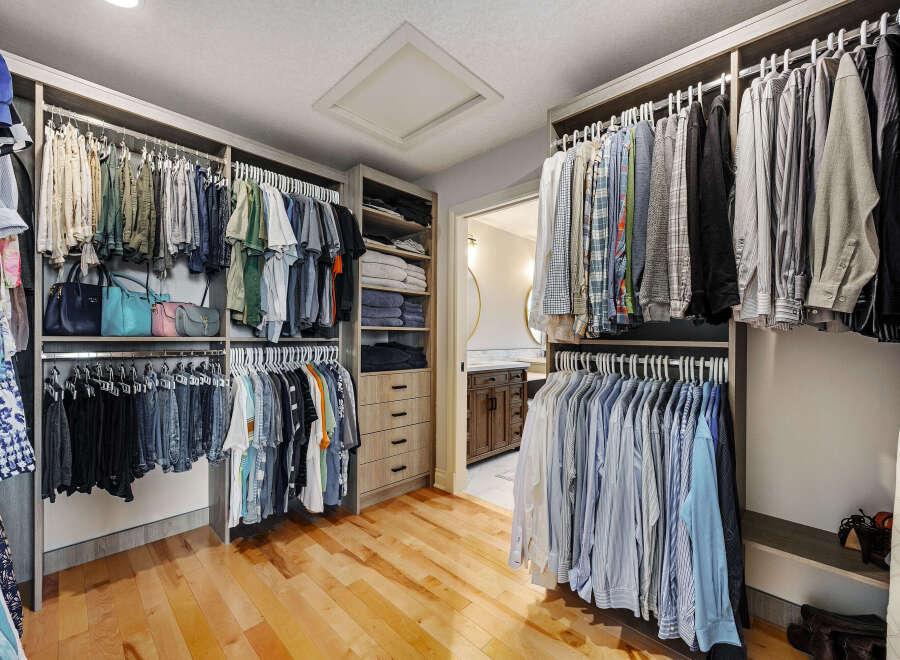 Step into luxury with this stunning walk-in closet, designed for both style and functionality.