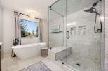 Step into luxury with this stunning bathroom featuring a modern freestanding tub, perfect for unwinding after a long day.