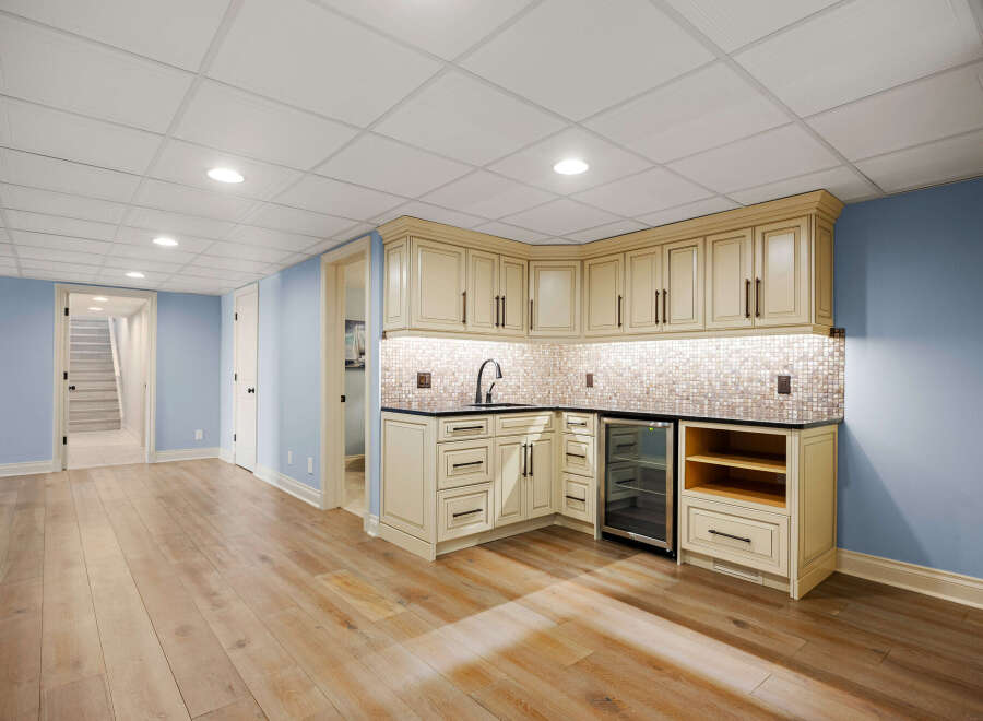 This stunning property boasts a beautifully designed wet bar, perfect for entertaining guests or enjoying a relaxing evening.